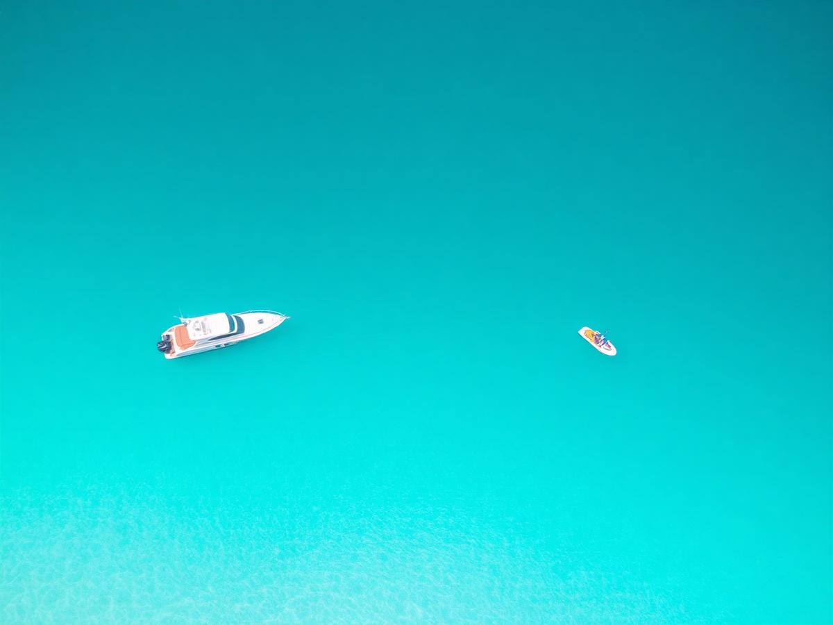 Yacht anchored over turquoise Bahamian water